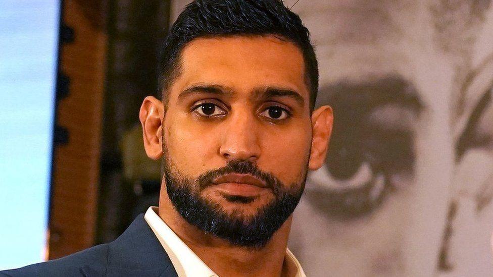 Amir Khan investigated by police for filming himself while driving - BBC News